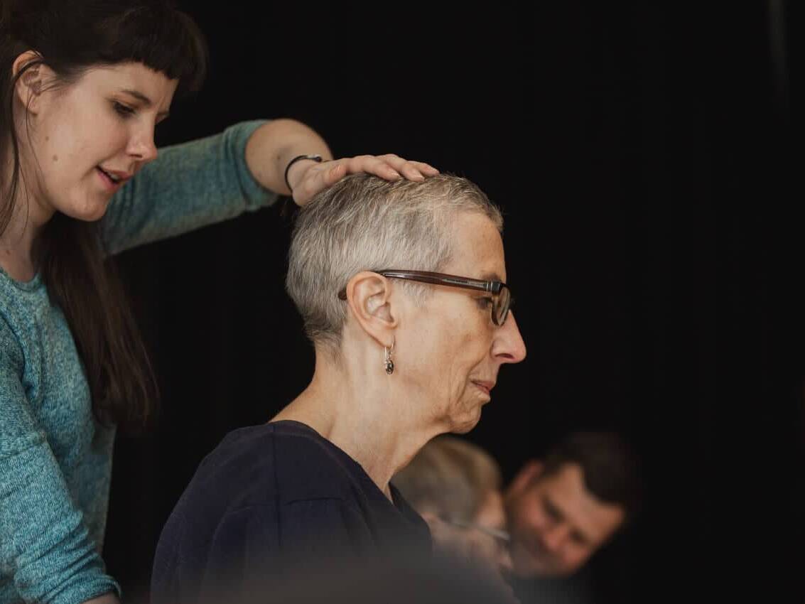 Woman with hand on head | Collective Identity