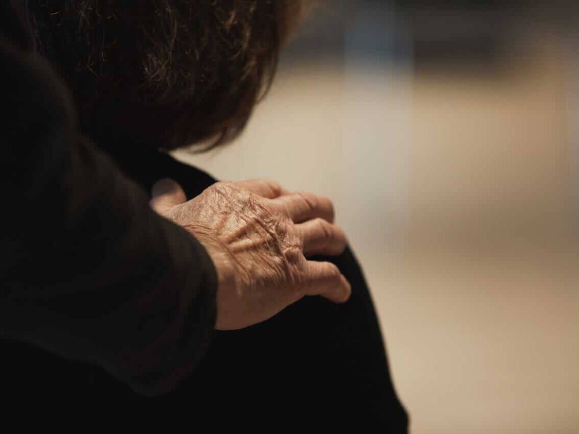 Hand on shoulder | Collective Identity