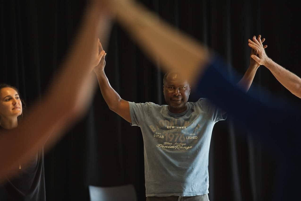 People with arms raised | Collective Identity